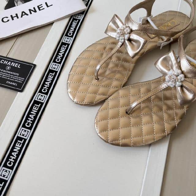 Alternative view of CHANEL GOLD QUILTED LEATHER WITH WHITE CAMELLIA CC LOGO BOW THONG SANDALS